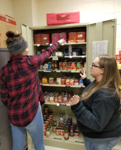 Volunteers restocking the student food pantry at Mountain Empire Community College.