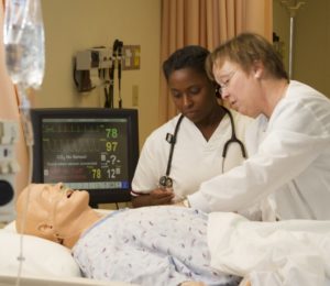 Students working on a patient dummy