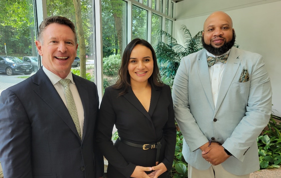Image of Chancellor Dore and two fellowship winners