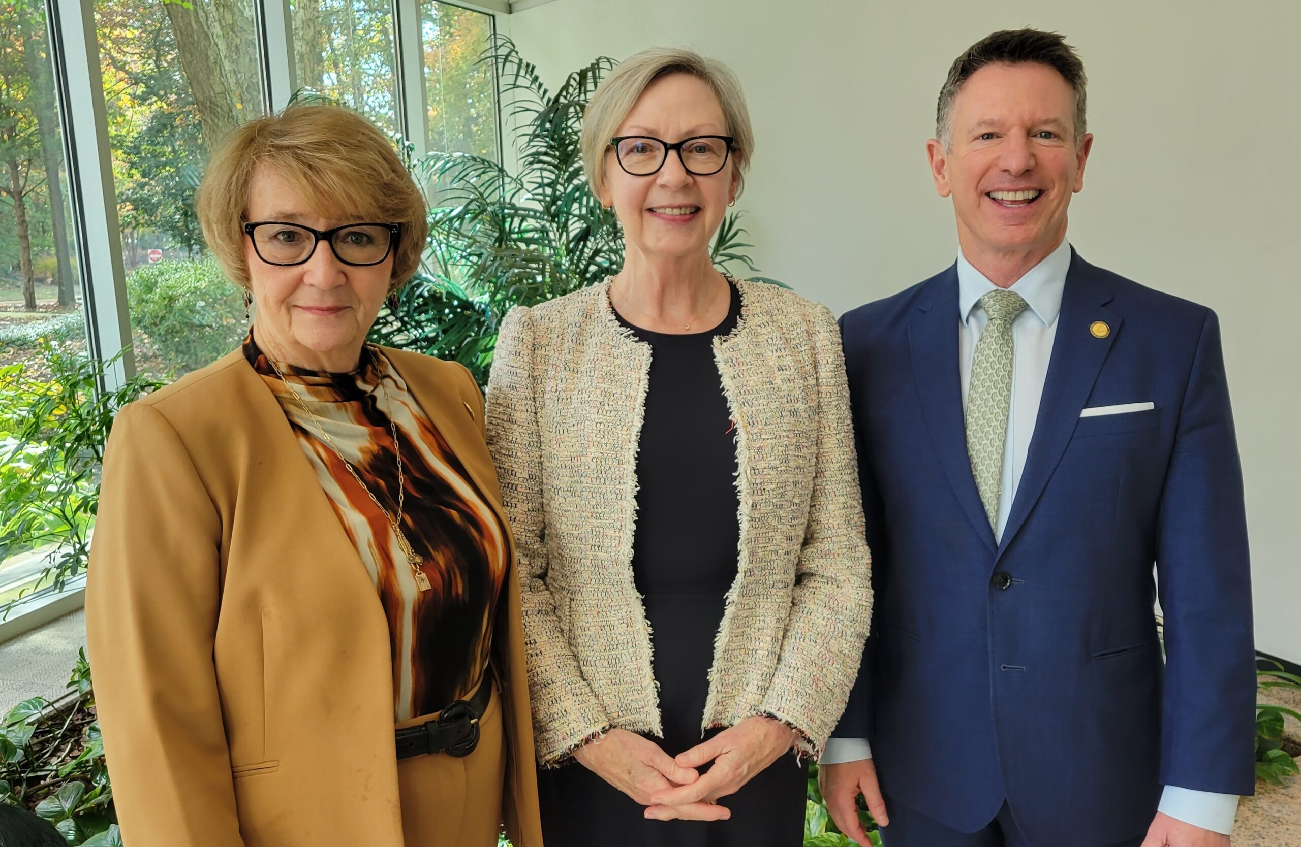Image of Board Chair Peggy Layne, Sharon Morrissey, and Chancellor Dore 