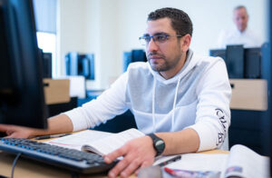 Man at desk working on computer