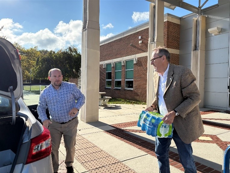 Picture4 WCC President Dean Sprinkle helps load supplies