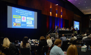 IT Summit Employers Wide 10 3 25 seated Summit attendees observing monitors