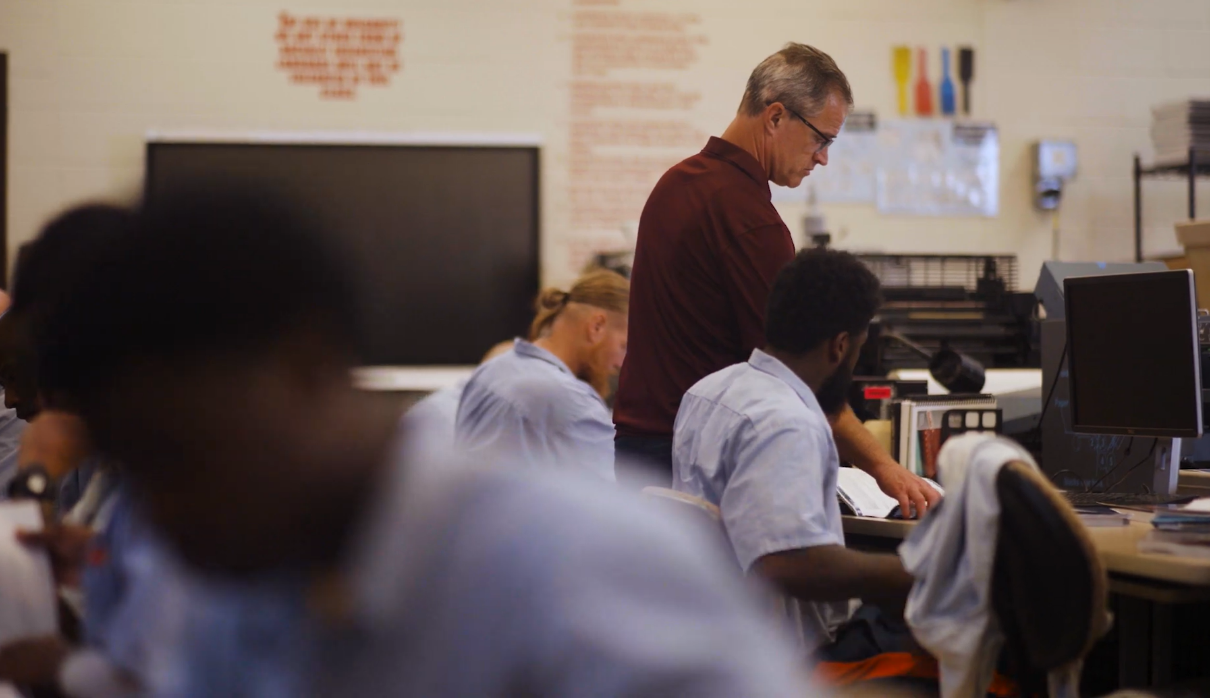 Picture2 Instructor walks around, visiting various inmate work stations